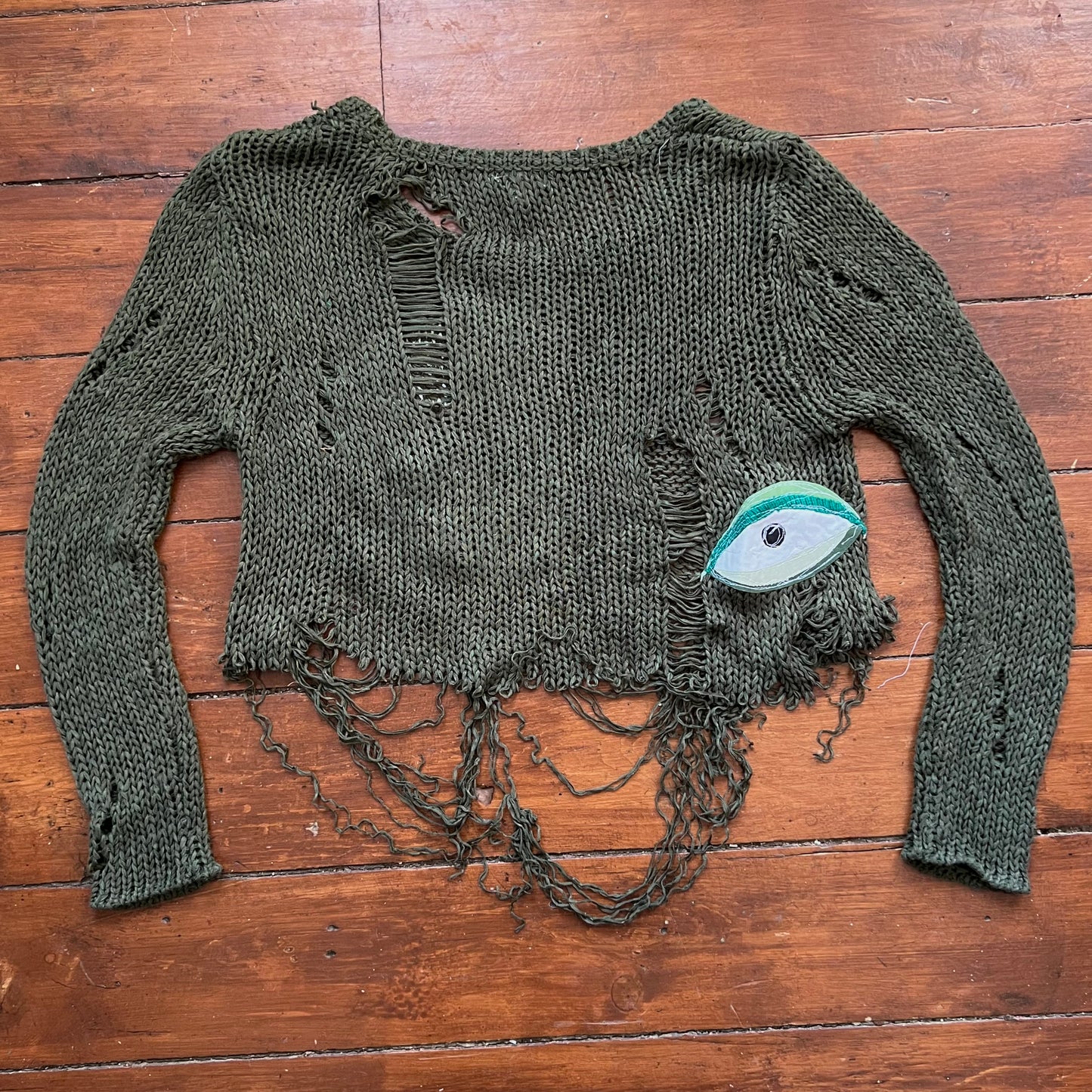 Green eyeball shrug