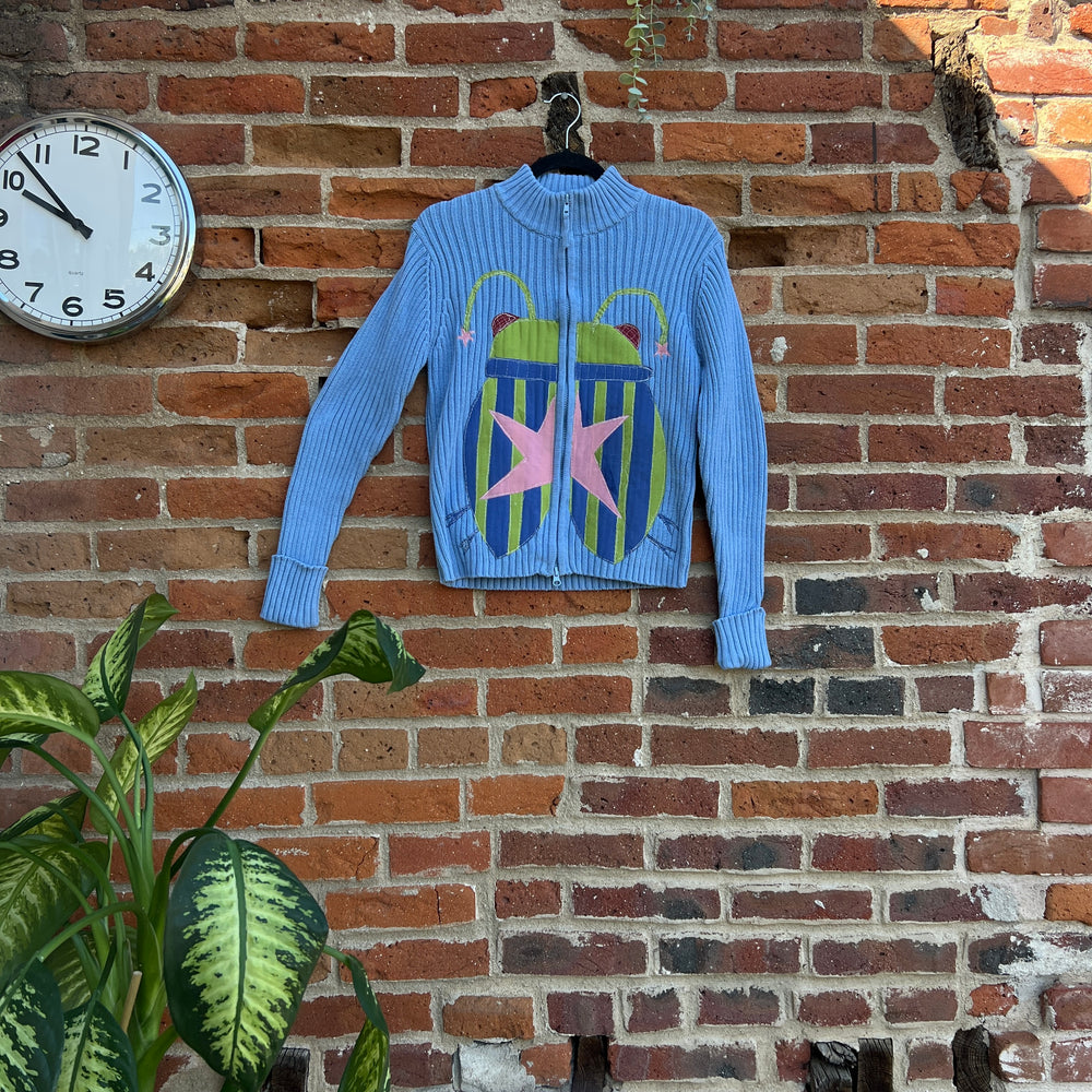 Star bug zip up sweater (s/m)