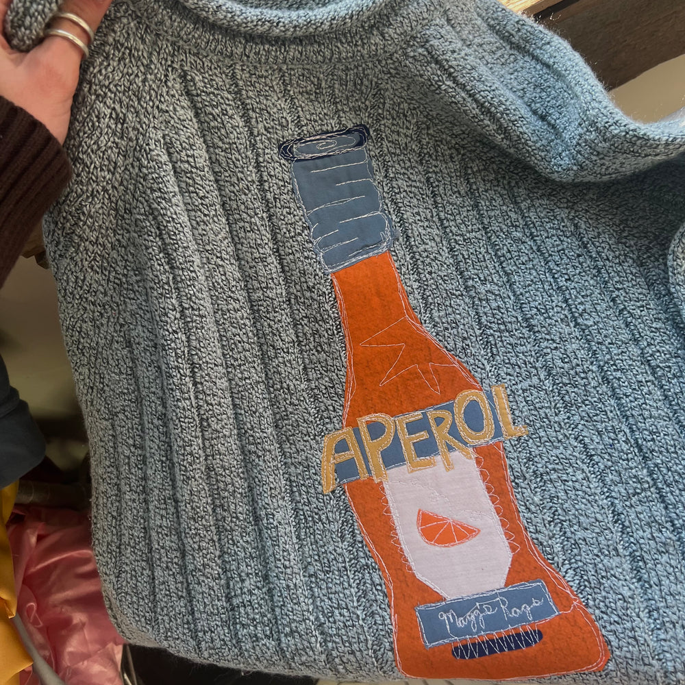 
                      
                        Aperol sweater(medium)
                      
                    