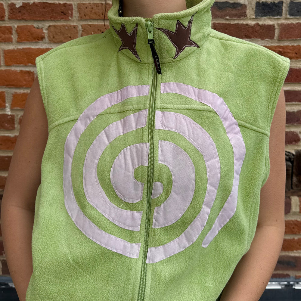 
                      
                        Swirl n’ star vest (medium)
                      
                    