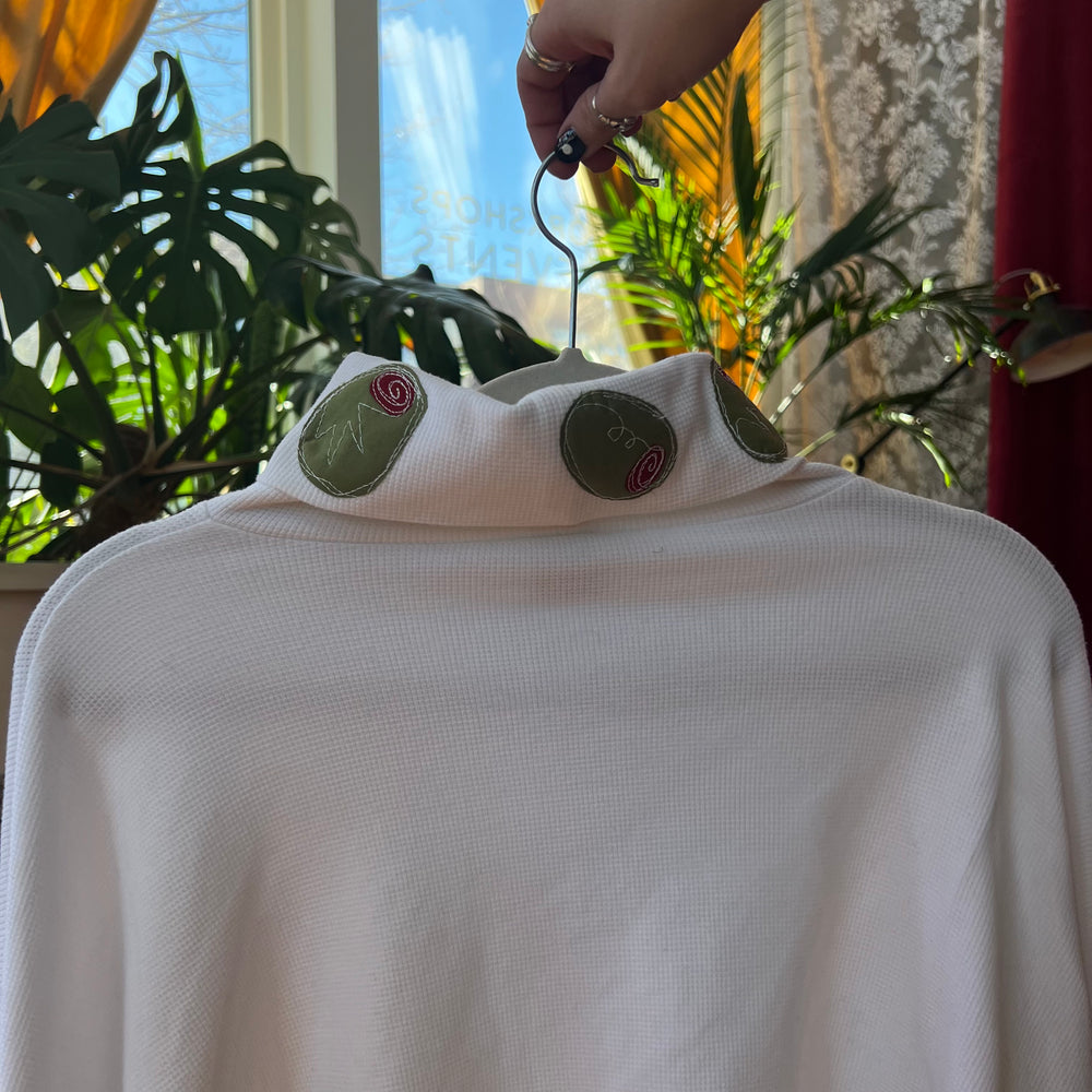 
                      
                        Olive trimmed turtle neck
                      
                    