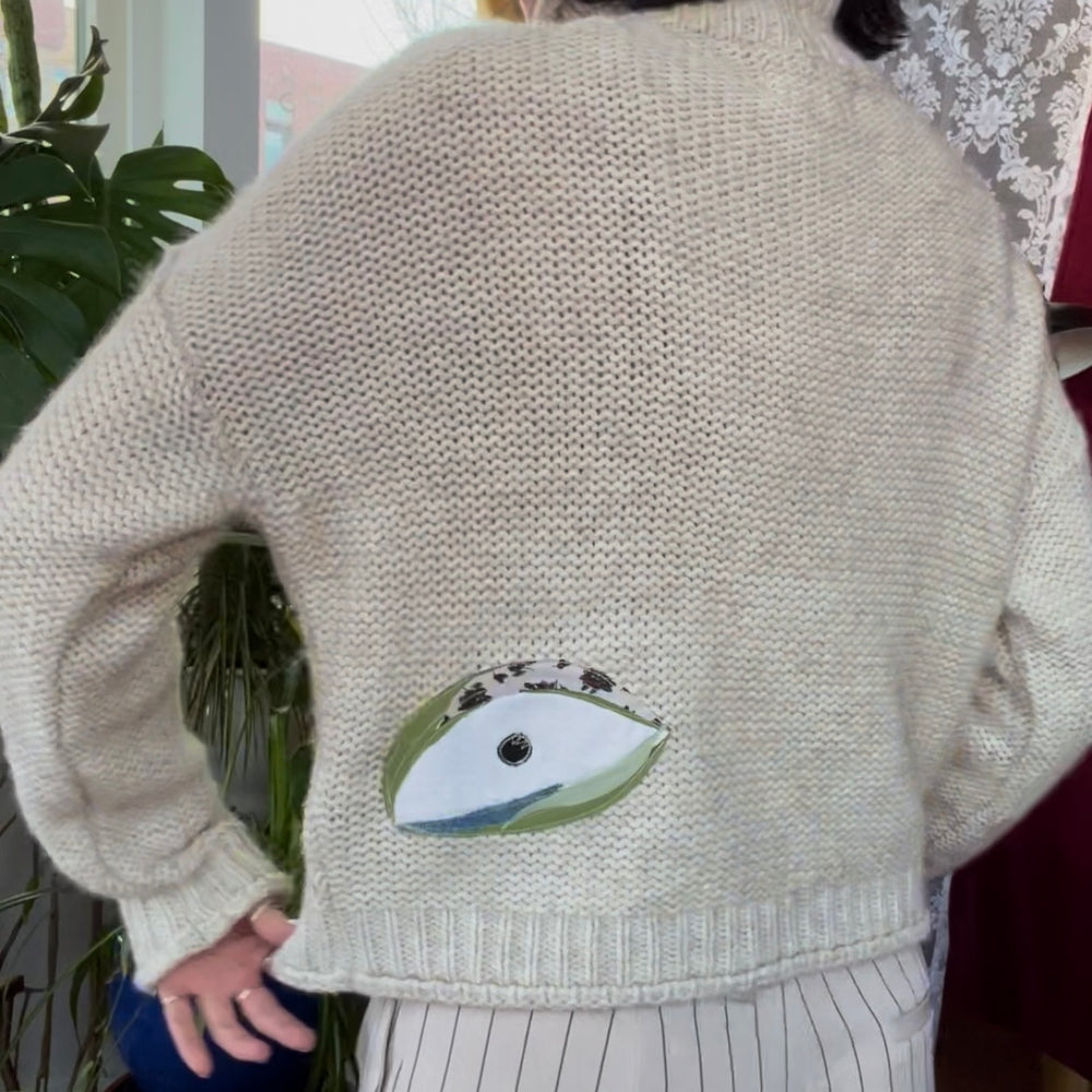 
                      
                        Eyeball knit turtleneck
                      
                    