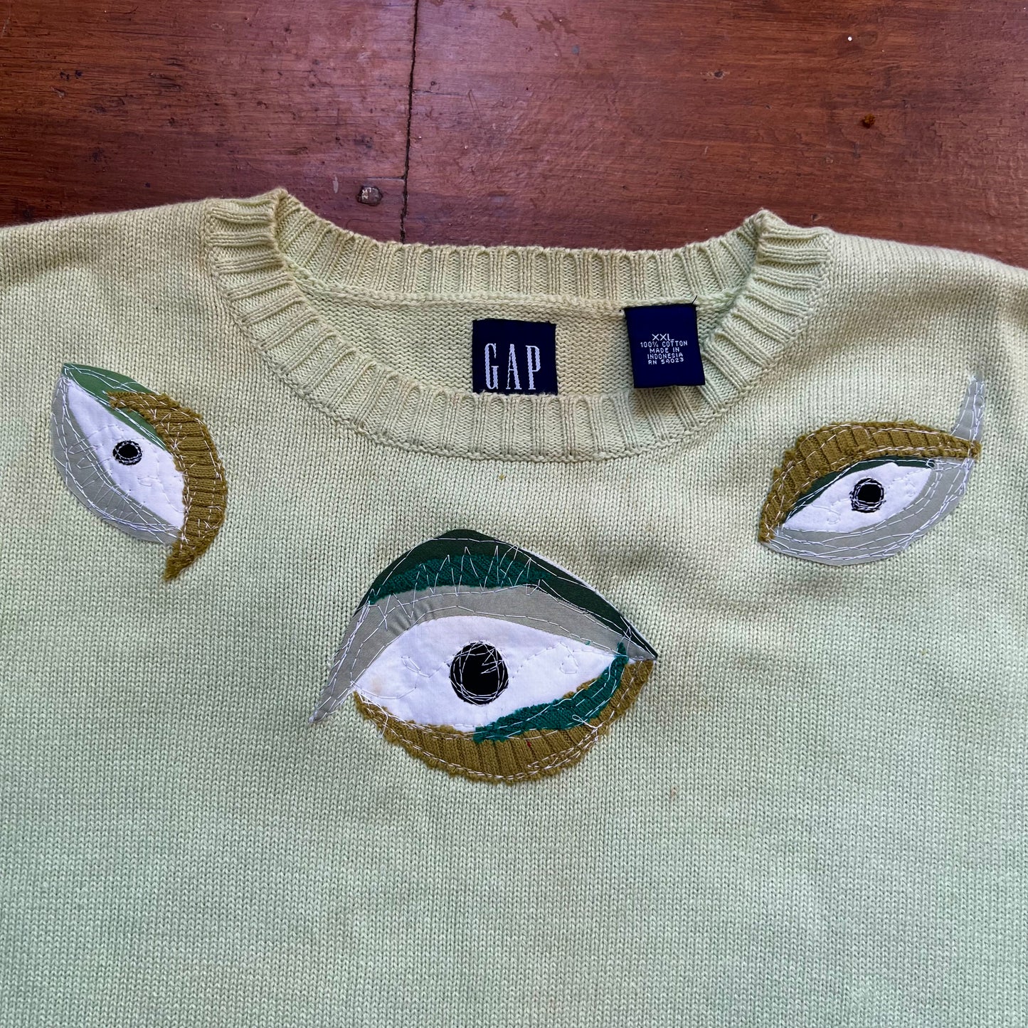 Green eyeball sweater