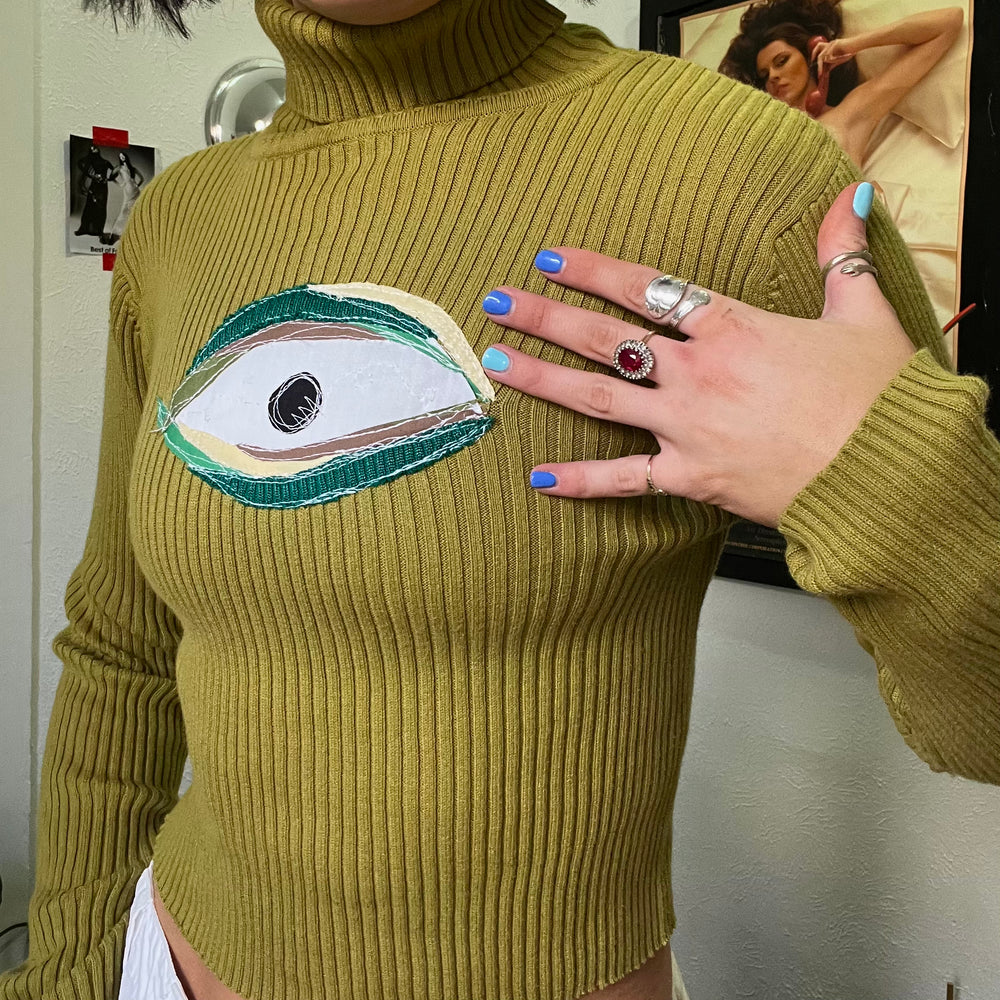 Green eyeball turtleneck