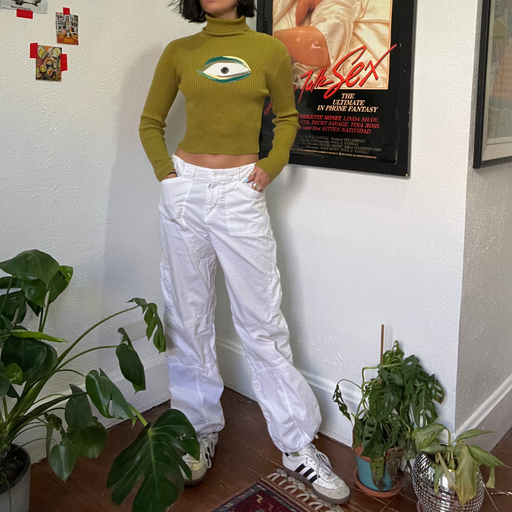 
                      
                        Green eyeball turtleneck
                      
                    